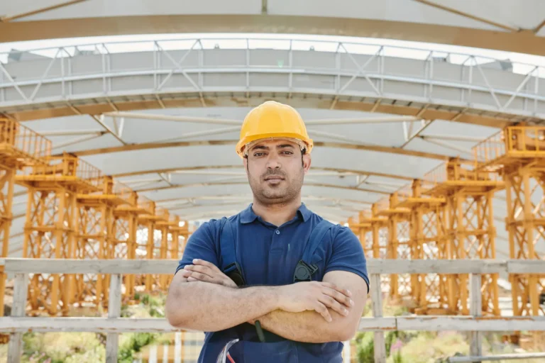 Inspector in a hard hat on site for a parking garage inspection in NYC