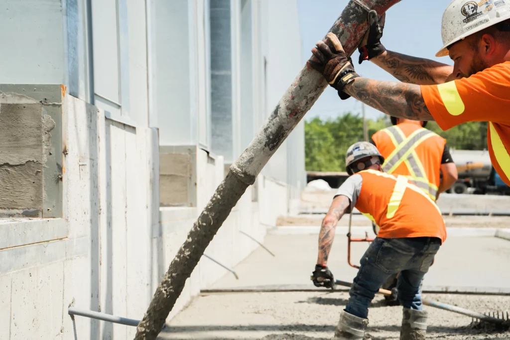 Construction crew working on a concrete floor while correcting an Unsafe condition under Local Law 126